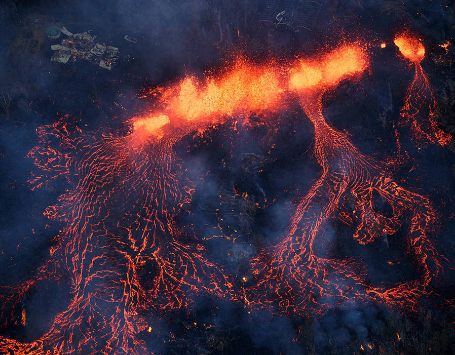 Activity continues on Kilauea's east rift zone, as a fissure eruption fountains more than 200 feet into the air, consuming all in its path., near Pahoa, Hawaii