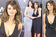 Penelope Cruz is smoking hot as she channels Donatella Versace in plunging red dress